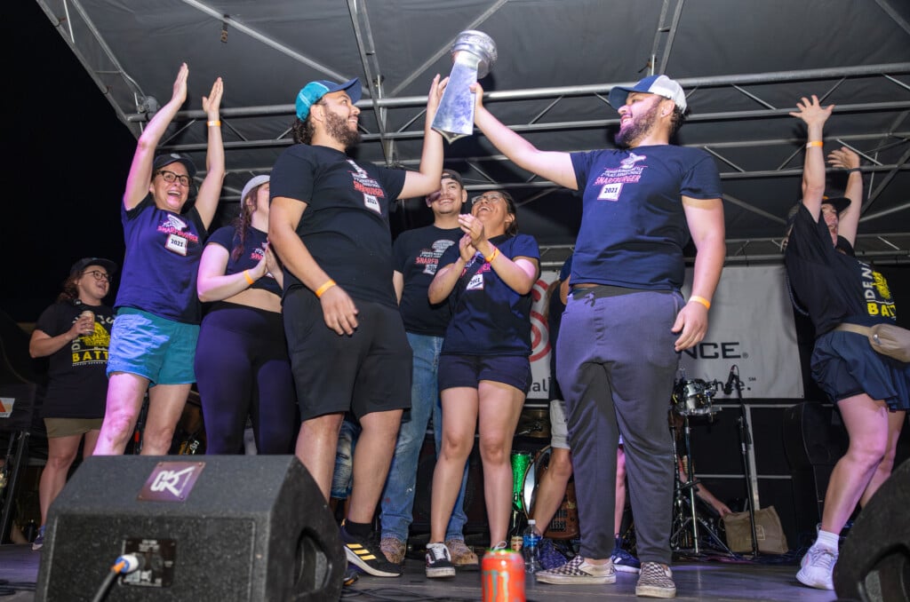 Snarfbuger team holding up a trophy at the 2023 Denver Burger Battle