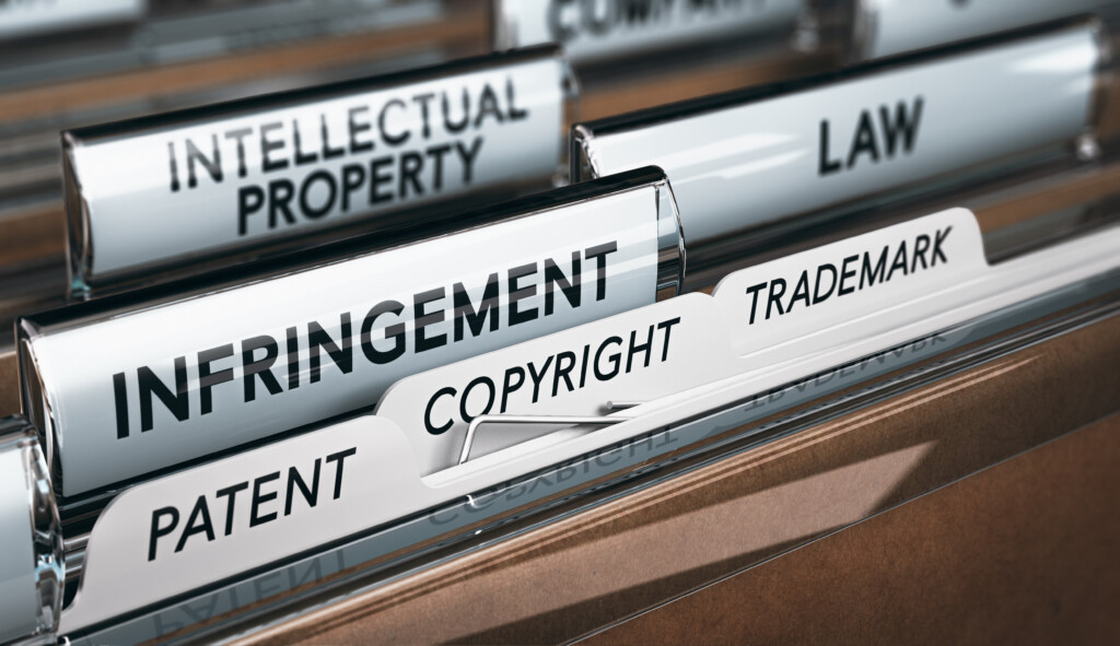 Protecting intellectual property rights for startups: 3D illustration of a folder, focus on a tab with the word infringement. Conceptual image of copyright law