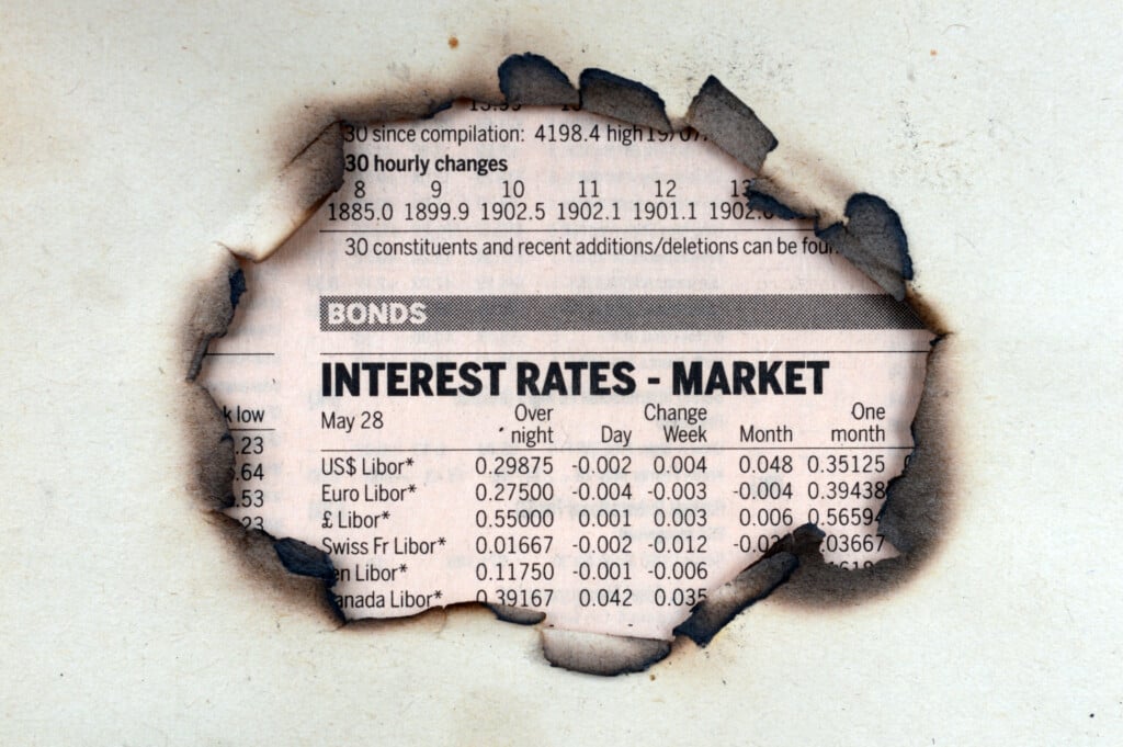 interest rate increase affect bonds — burned paper with interest rate stats