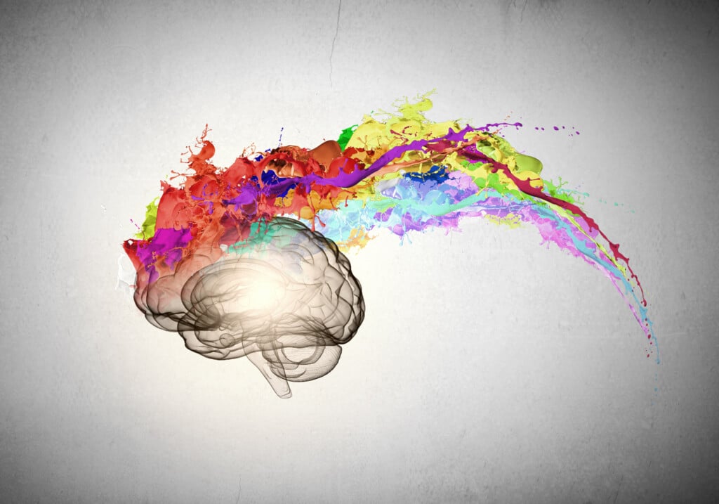 Color psychology concept: brain with colorful paint exploding out