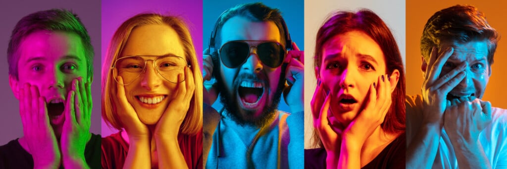 emotional marketing concept: five people looking shocked or happy, illuminated by different neon colors