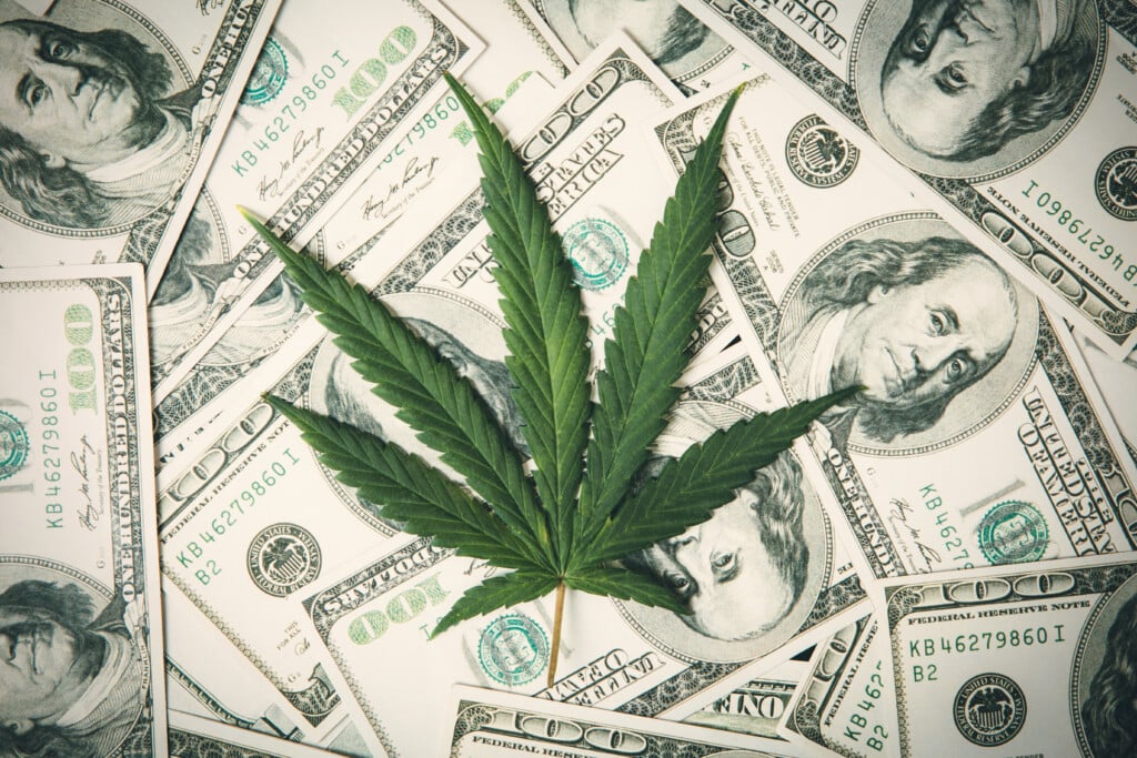 Colorado cannabis industry concept: Marijuana Leaf And Us Dollar Banknotes. Marijuana Business Concept. Cbd Medical Marijuana Dollar Thc Cannabis.