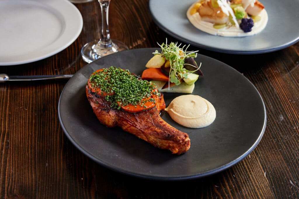 Grilled Pork Chop Artichoke Mustard Roasted Vegetables Nduja Butter