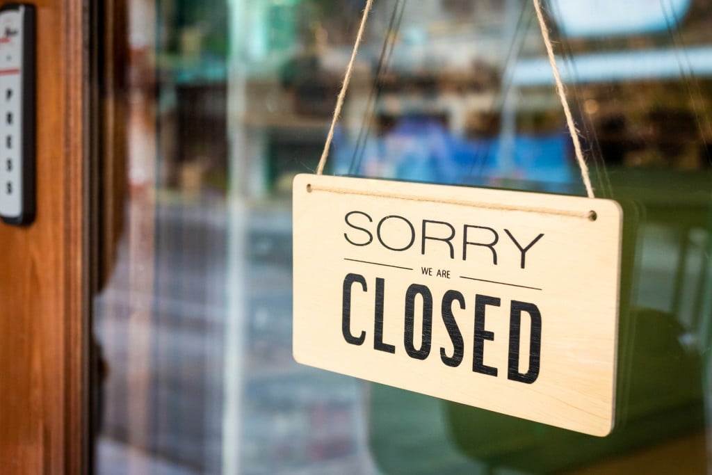 Sorry We Are Closed Sign Board Hanging On Door Of Cafe