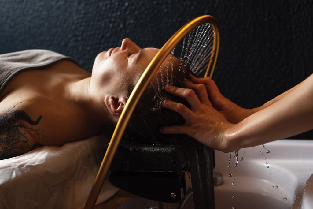 Masseur Doing Massage The Head And Hair For An Woman In Spa Salon.