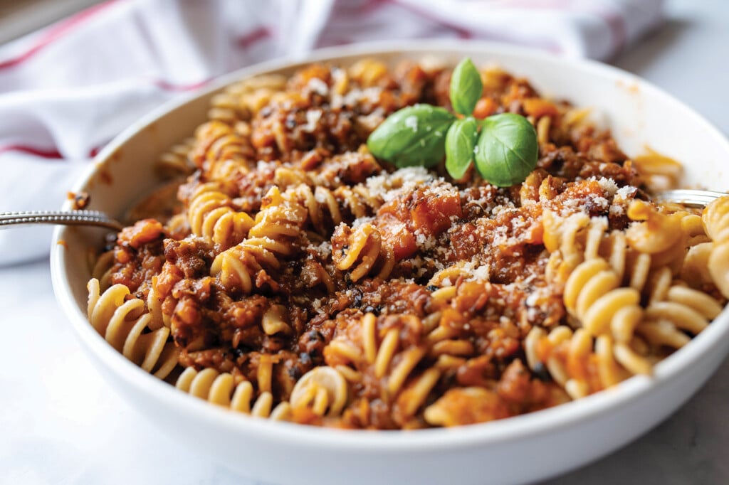 Vegan Lentil Bolognese With Whole Wheat Pasta On A Plate