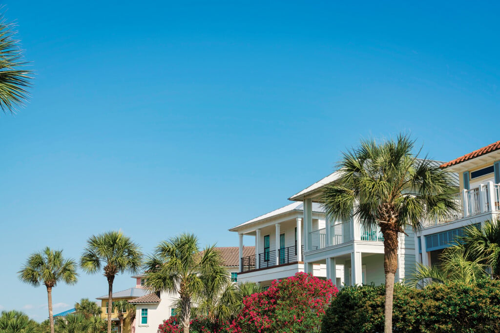Views Of Houses With Bougainvillea And Palm Trees At The Front In Destin, Florida