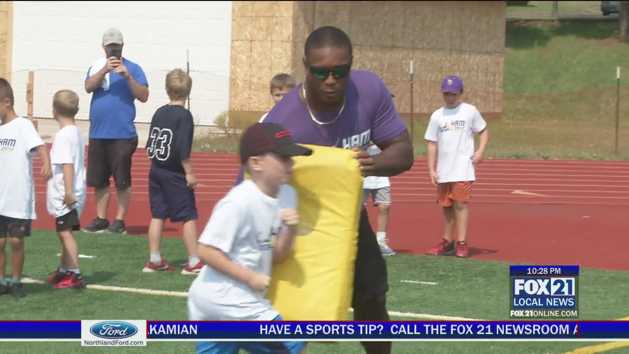 Photos and video: C.J. Ham returns to Denfeld for youth football camp -  Duluth News Tribune