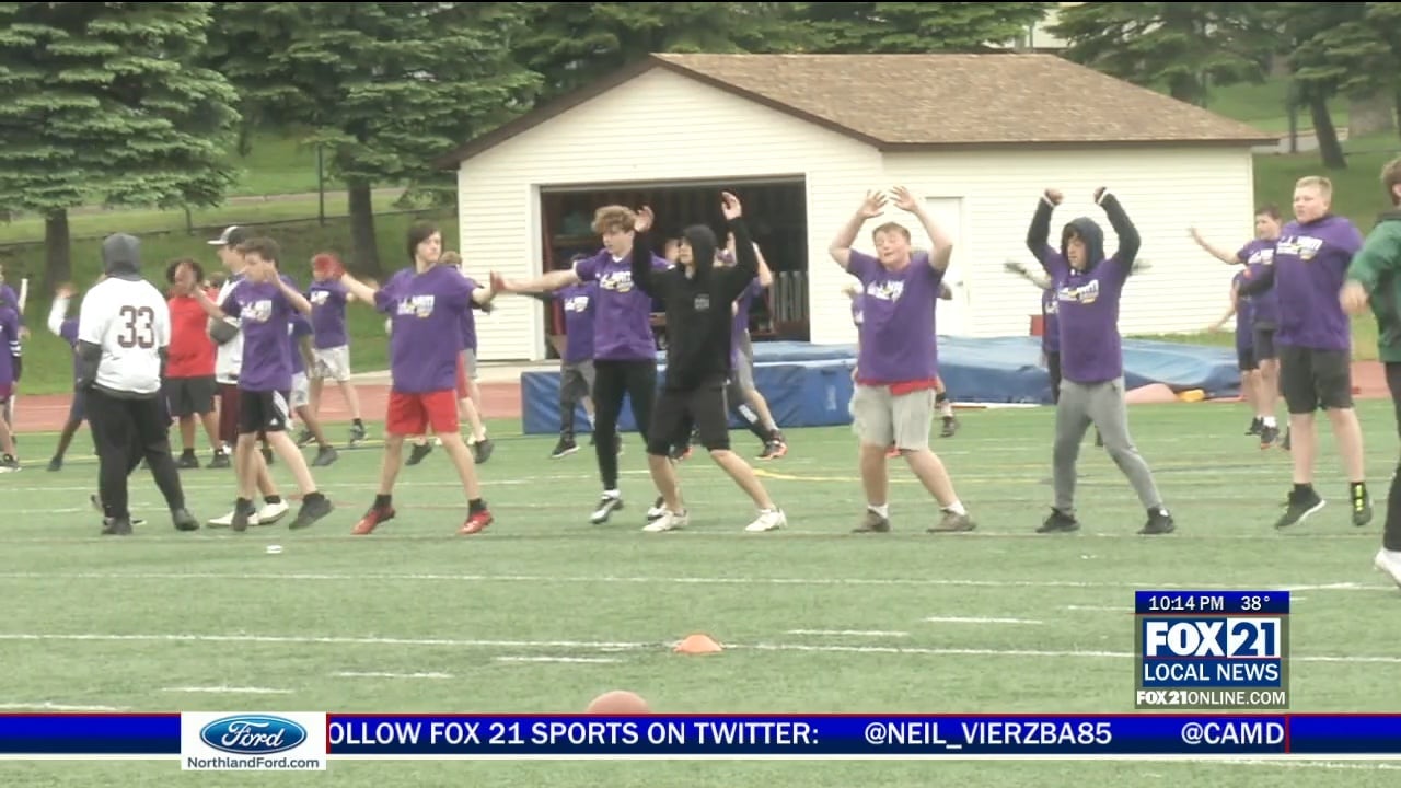 Photos and video: C.J. Ham returns to Denfeld for youth football