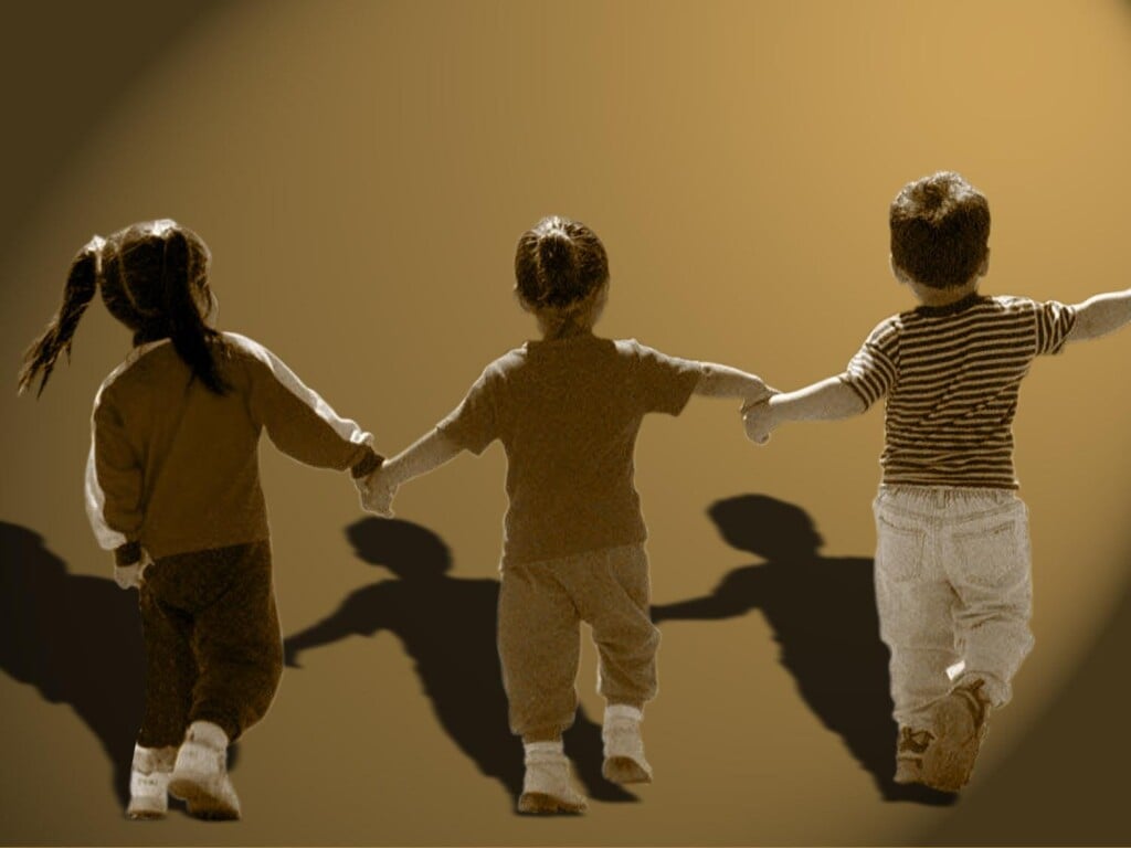 Group Of Children Hold Hands In Line On Texture