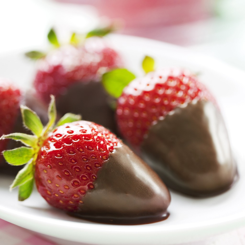 A Plate Of Chocolate Dipped Strawberries