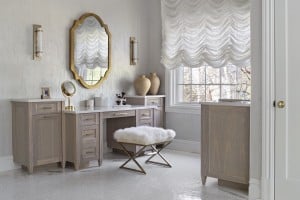 In the corner of the bathroom where the tub used to be, there’s now a multi-drawer makeup vanity and a built-in coffee bar.