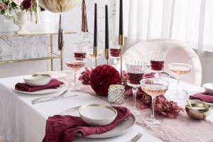 Festive Table In Pink And White With Honeycomb Balls As Decoration