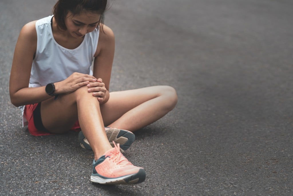 Knee Pain. Sport Injury, Women Has Knee Pain During Outdoor Exercise. Sports Running Knee Injury In Women Runner.