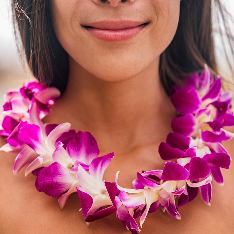 Lei Hawaii Welcome Necklace Of Fresh Orchids Flowers Garland On Woman's Neck. Aloha Spirit. Hula Dancer At Luau Beach Party
