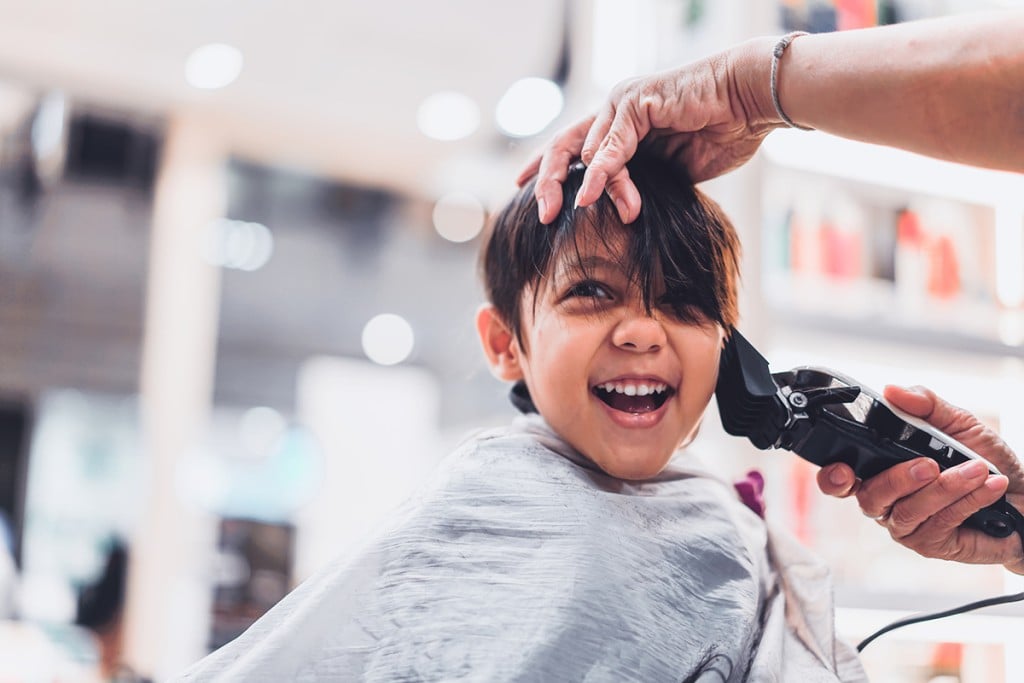 Barbershops put books in hands of kids getting haircuts