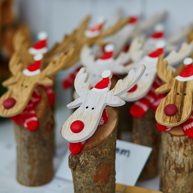 Funny,wooden,moose,deers,with,red,noses,and,santa,hats