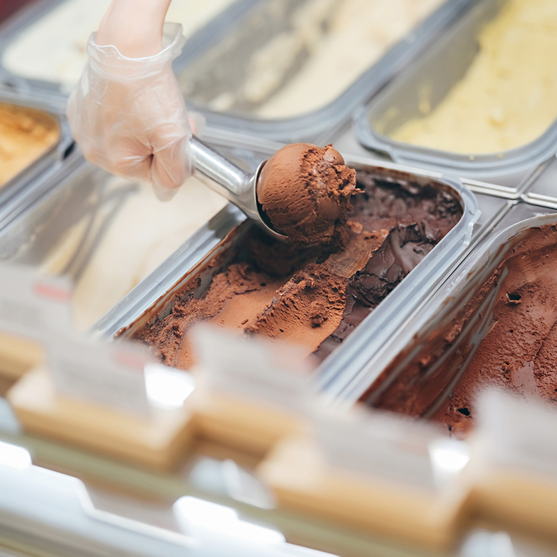 Close Up Of Scooping Ice Cream In Gelato Cafe