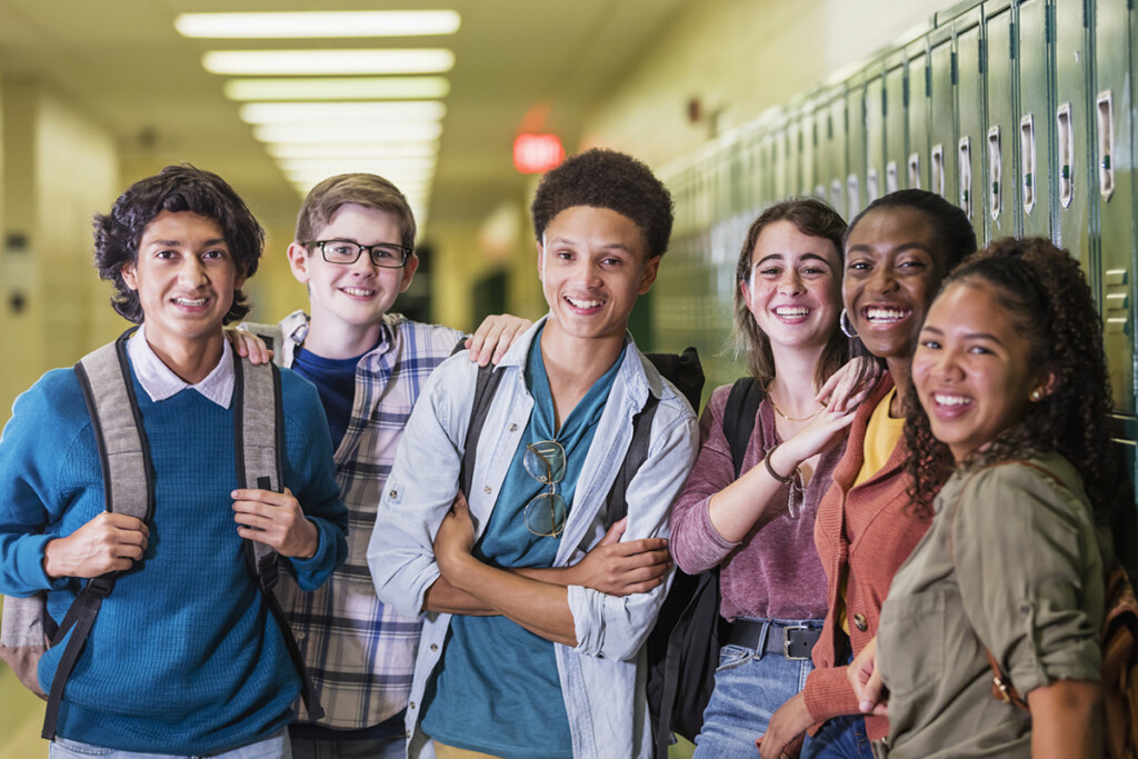 Multi Ethnic High School Students Hanging Out In Hallway
