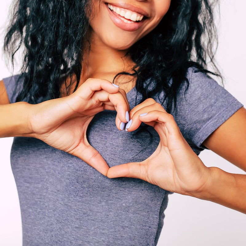 Love You. Close Up Photo Of African American Woman Palms, Showing A Hand Heart To The Camera.