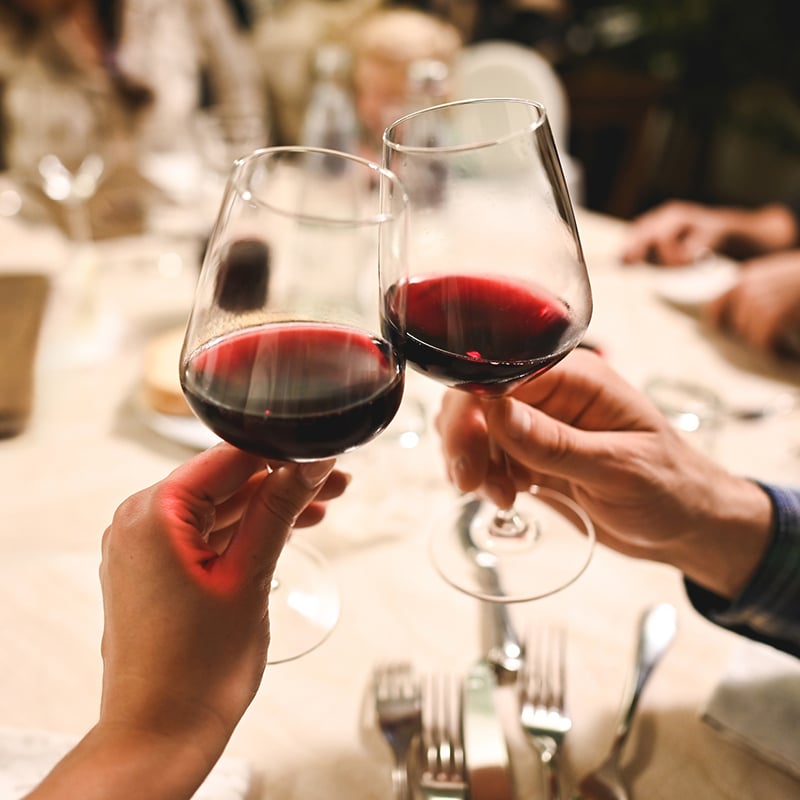 Drinking Red Wine At Dinner In Restaurant.