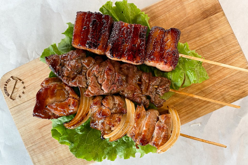 Grilled meat on sticks.