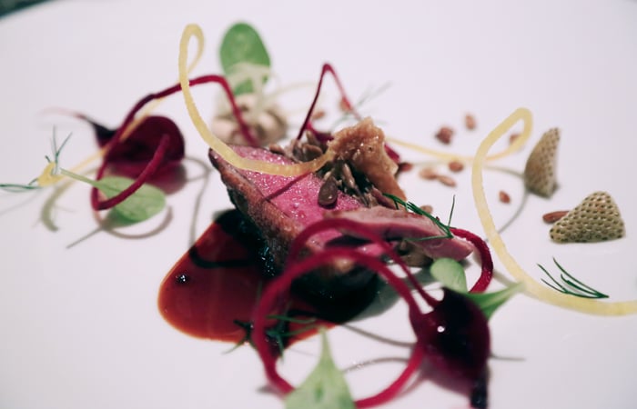 Often a restaurant will overcook squab into a rubbery hunk, but Duffy and his team cook it perfectly. I glimpse the inner workings of Duffy's mind: He plays a twisted joke on the diner by plating the squab with its food, sunflower seeds and unripened strawberries.