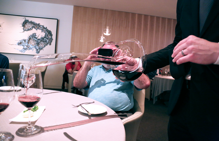 This Riedel decanter is in the shape of a cobra. It's an impressive way to deliver the wine pairings. Kyle's dad is just as impressed as we are and snaps a photo.