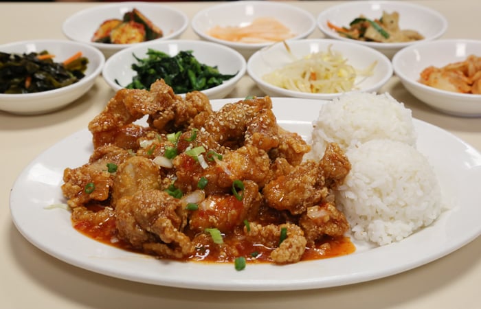 The spicy garlic chicken ($12.95) jumps out at me. The crispy pieces are battered, deep fried and tossed in a sweet chili sauce loaded with garlic. The sticky sauce is familiar and delicious. 