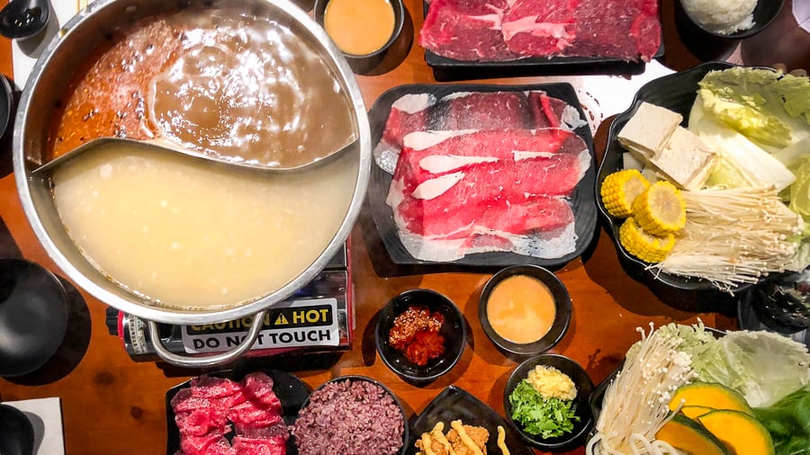 Cafe Asia hot pot table with various ingredients