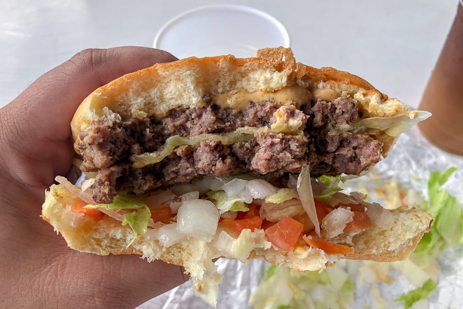 A half-eaten Costco cheeseburger