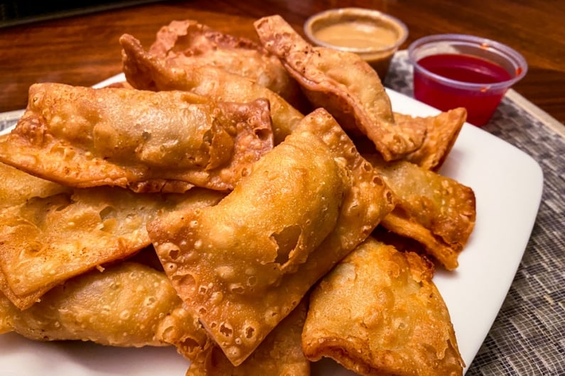 pile of golden brown crispy gau gee on a plate