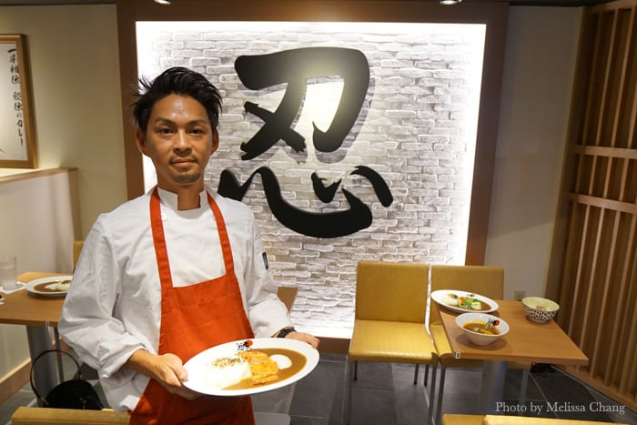 Nin Nin Curry manager Shohei Nakamura with a plate of tonkatsu curry ($13.50).