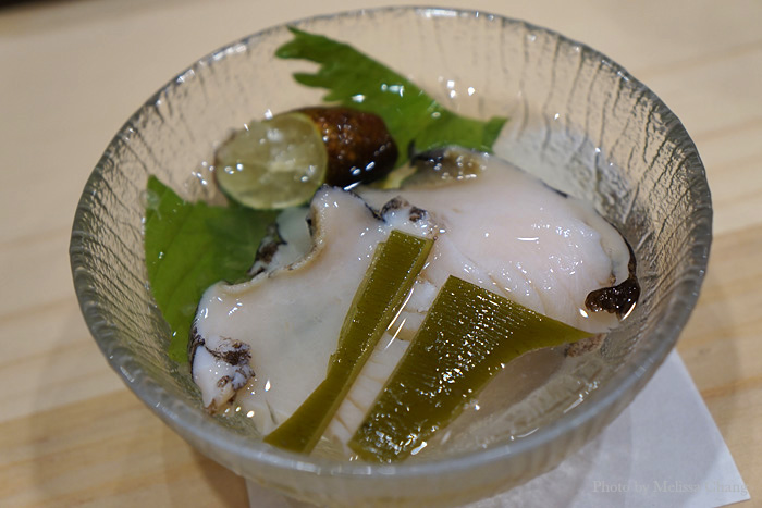 More Kona abalone, this time salted, shucked and sliced right before us. The dashi isn't for drinking, but with the mix of herbs and finger limes, it makes the abalone taste like it came right out of the ocean. You can eat the konbu, which is imported from Hokkaido.