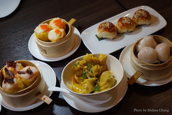 Clockwise from left: Phoenix tail shrimp shumai, scallop shumai, venison puffs, har gau, pork dumplings with spicy sesame oil.
