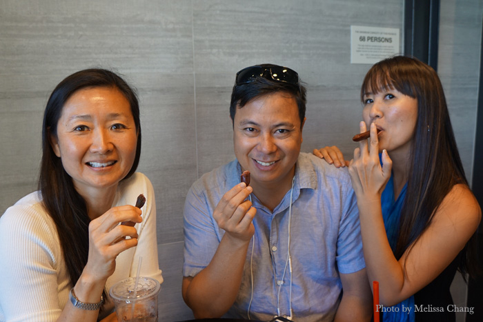 My panel of taste testers, from left: Diane Seo, Kaimana Pine, and Edwina Minglana (who does not know how to smoke a cigar in real life).