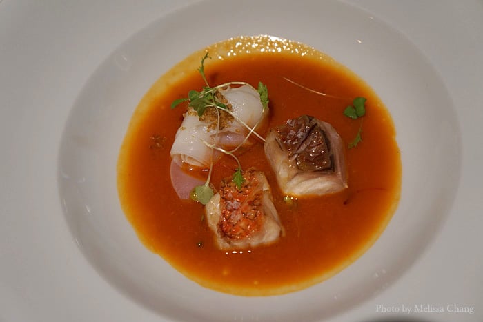 Redfish cacciucco soup with cuttlefish "noodles" and crispy quinoa.