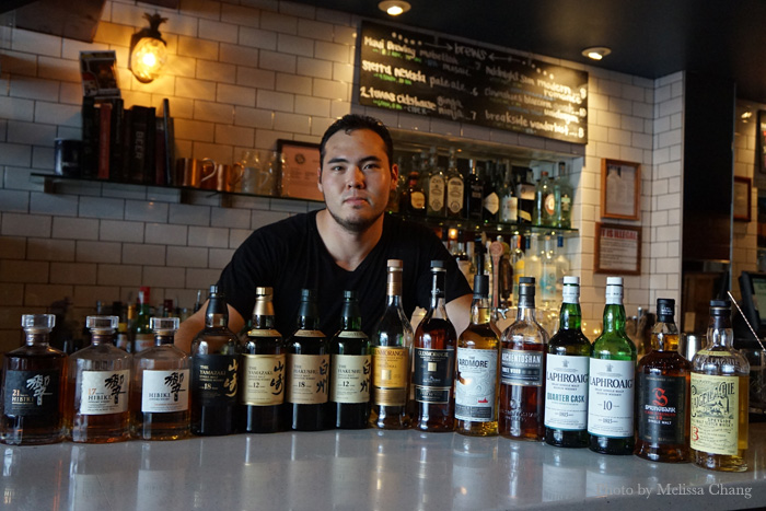 Bar manager Joe Arakawa with the whiskies for June 8.