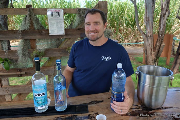 Ocean Vodka's Shay Smith on the farm with the distilled spirits.