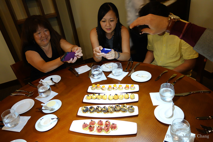 What our dinners usually look like: Asians taking pictures of their food.