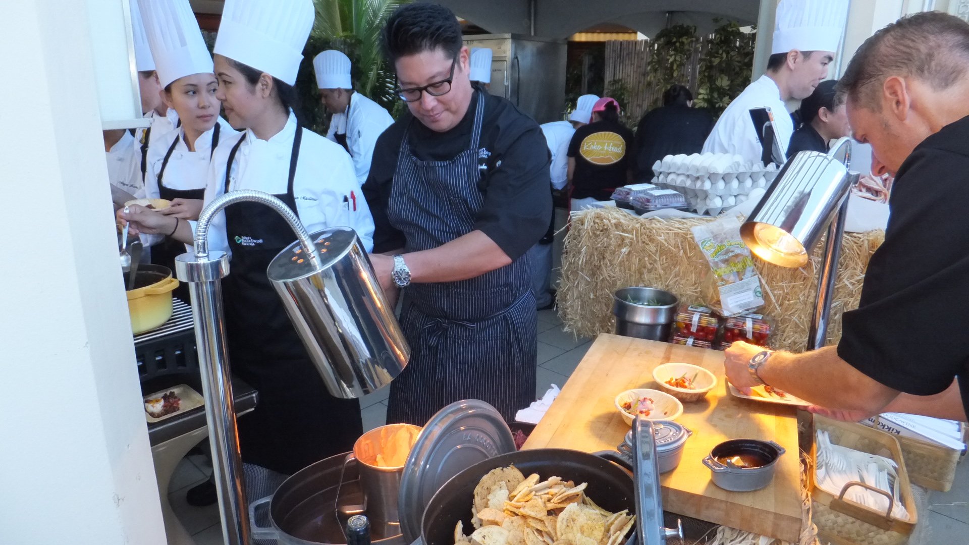Jon Matsubara, chef de cuisine Japengo Restaurant, helping Sven Ullrich with his soft boiled egg and bacon jam.