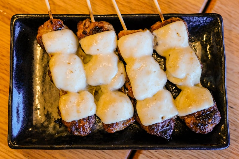 Tsukune cheese are delightful little chicken cheeseburgers on a stick. You can't hate on these...you just can't! 
