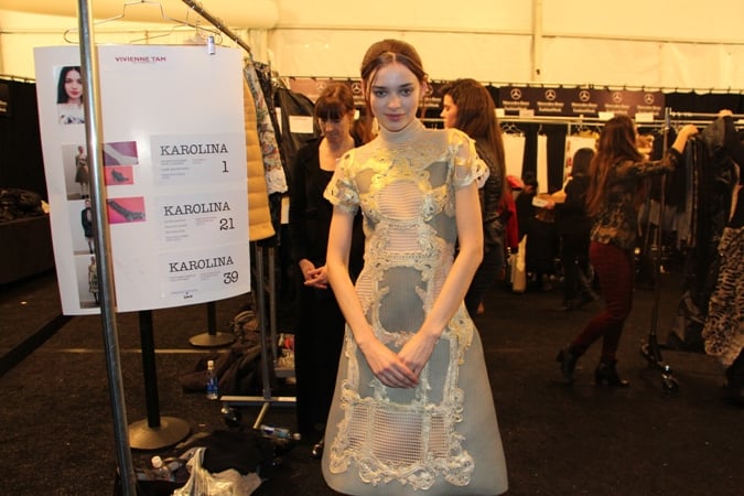 Backstage with model Karolina who was first in the line-up. She's pictured next to her model card and changing area.
