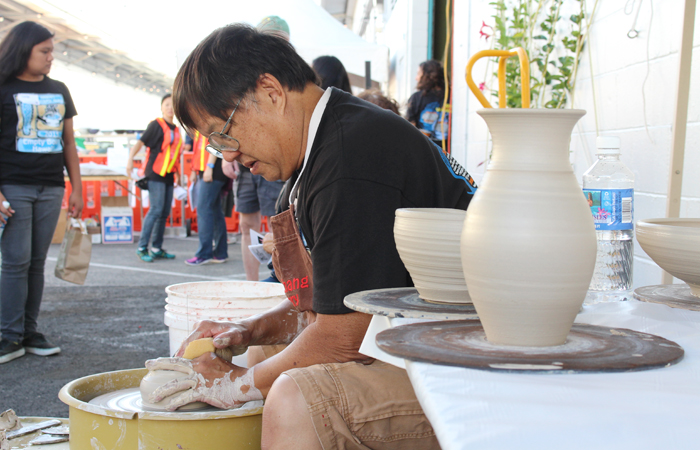 Professional potter, Jeff Chang, entertained the crowd and started throwing pots early in a bowl-making demo.