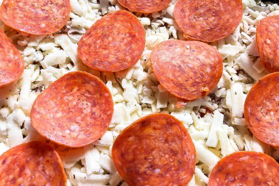 Pepperoni slices on a cheese pizza