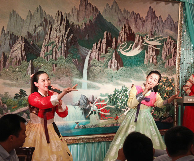 The waitresses put on a show every night in Pyongyang. Photo by UnTour Shanghai