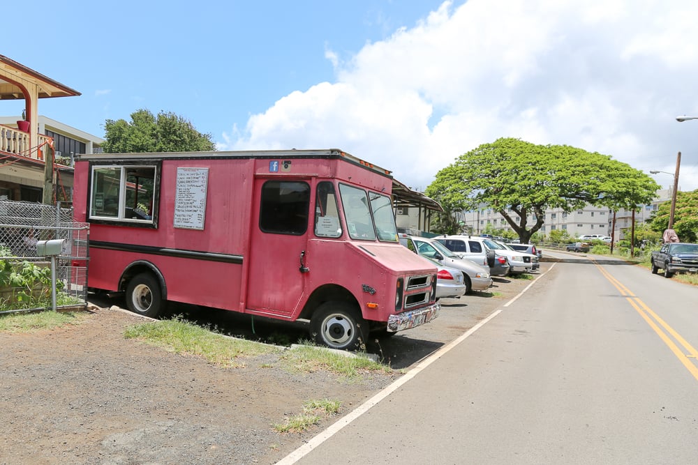 Drive down Kohou St. right after the entrance to Damien and look for a bright pink food truck parked in the driveway of a home. 