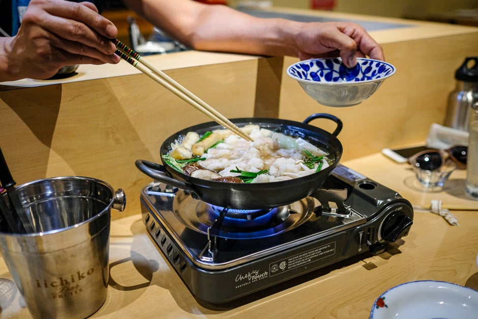 Anchan delicately loads a bubbling nabe pot with motsu, fatty beef offal that melts into the peppery broth. 