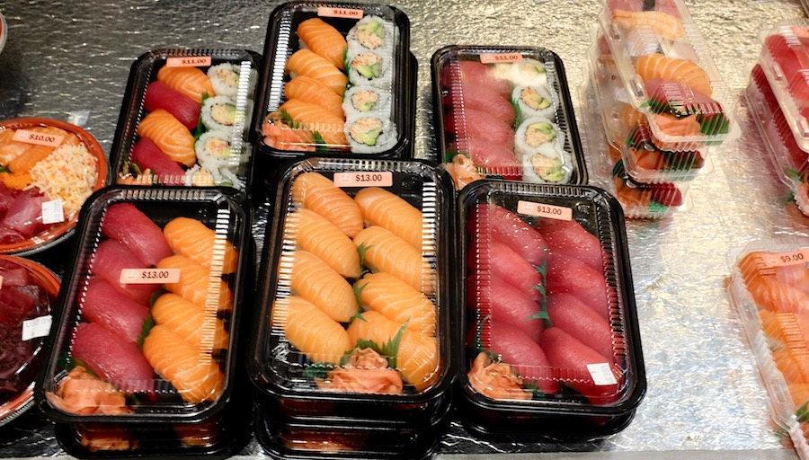 assorted packs of nigiri sushi to go
