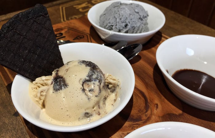 Joe Gets Nuts features coffee ice cream with homemade macnut brownie bits; it’s finished with a chocolate waffle cone piece.